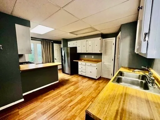 a kitchen that has a sink and a stove