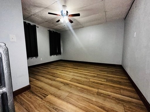 59 14th Avenue, Unit 2 Haverhill, MA 01830 - Photo 7 of 11 a view of an empty room with wooden floor
