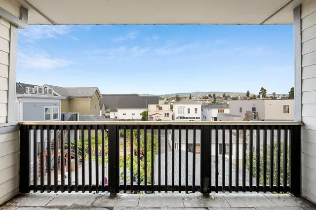 a view of a balcony with wooden floor
