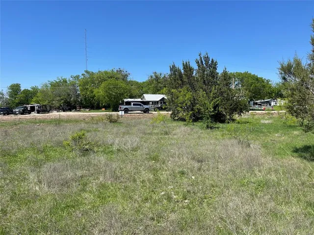 a view of a large yard with an outdoor space