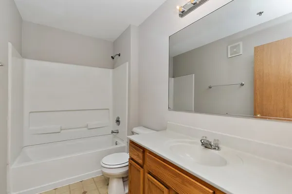 a bathroom with a sink a toilet and a bathtub