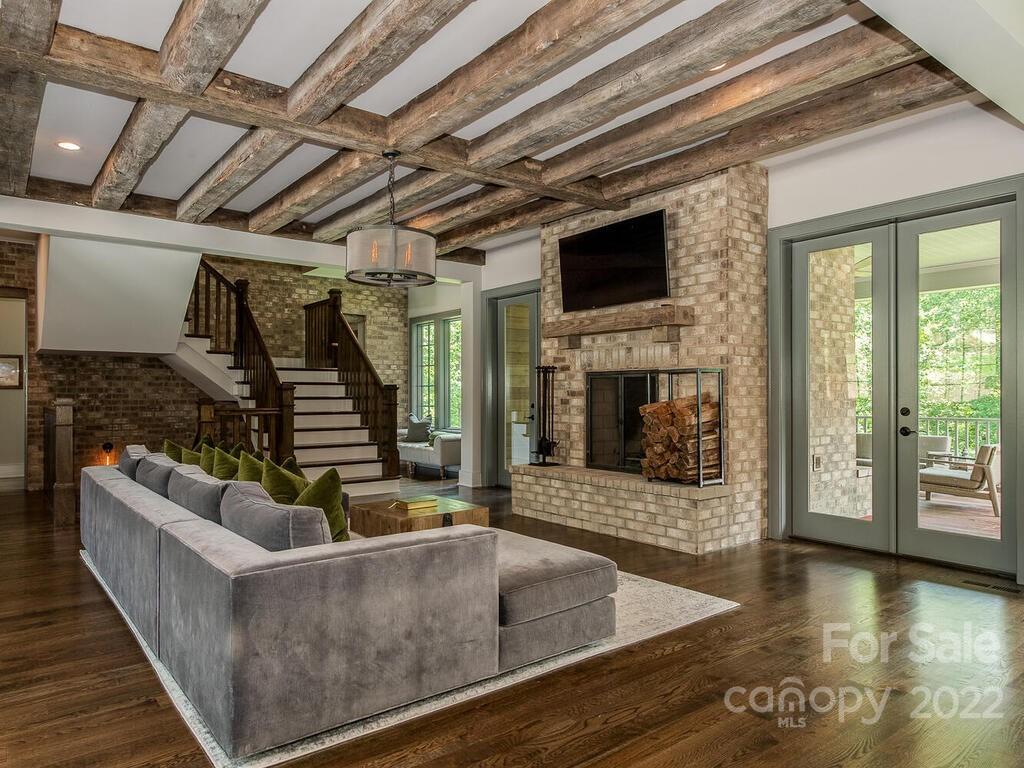 13601 Girl Scout Road Charlotte, NC 28278 - Photo 13 of 45 a living room with fireplace furniture and a flat screen tv