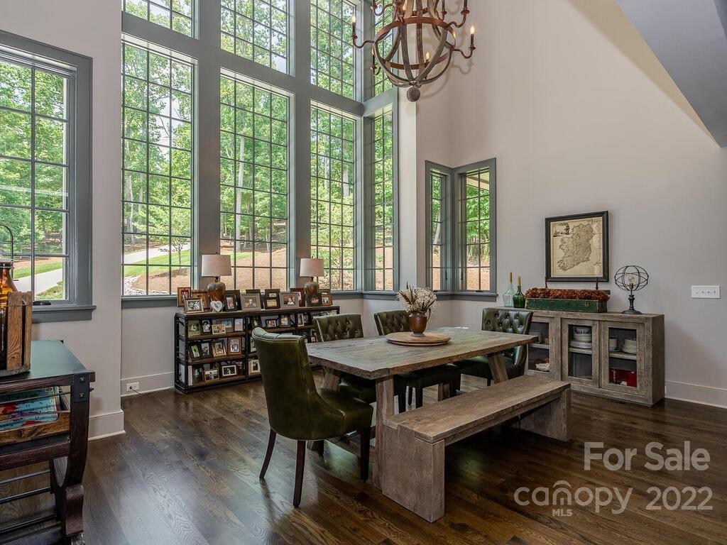 13601 Girl Scout Road Charlotte, NC 28278 - Photo 14 of 45 a view of a dining room with furniture window and wooden floor