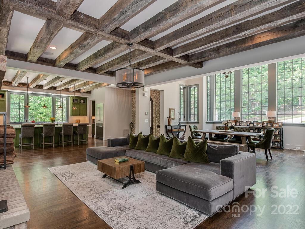 13601 Girl Scout Road Charlotte, NC 28278 - Photo 16 of 45 a living room with furniture large wooden floor and a table