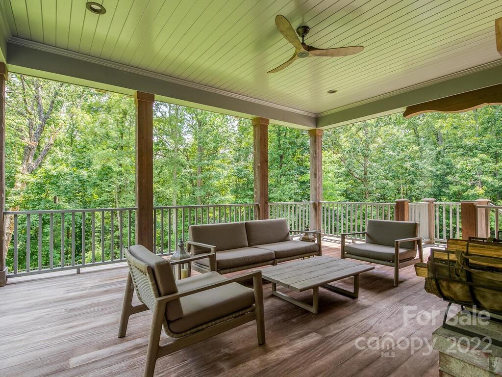 13601 Girl Scout Road Charlotte, NC 28278 - Photo 17 of 45 a living room with furniture and a floor to ceiling window