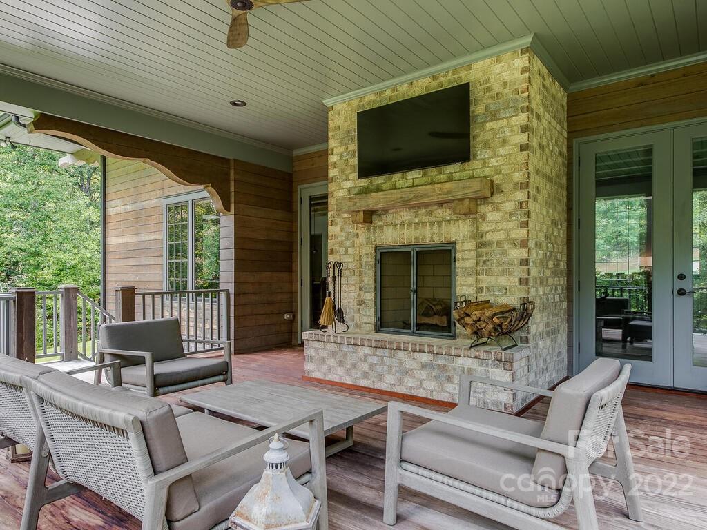 13601 Girl Scout Road Charlotte, NC 28278 - Photo 18 of 45 a outdoor space with patio the couches and a fireplace