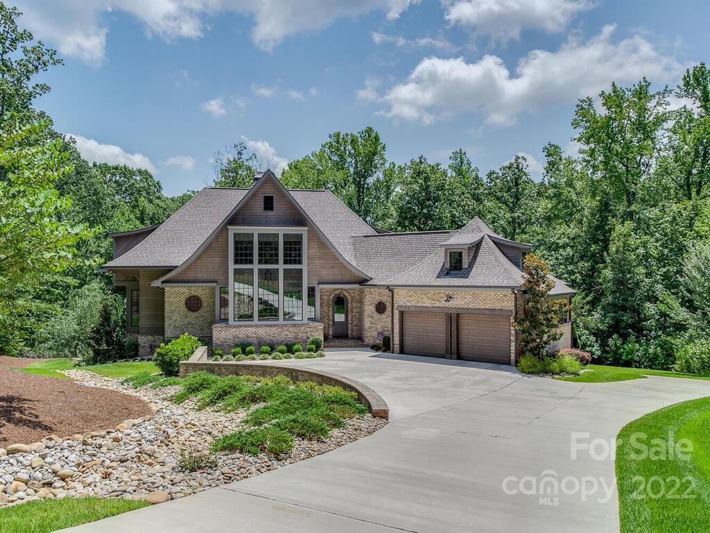 13601 Girl Scout Road Charlotte, NC 28278 - Photo 2 of 45 a front view of a house with a garden