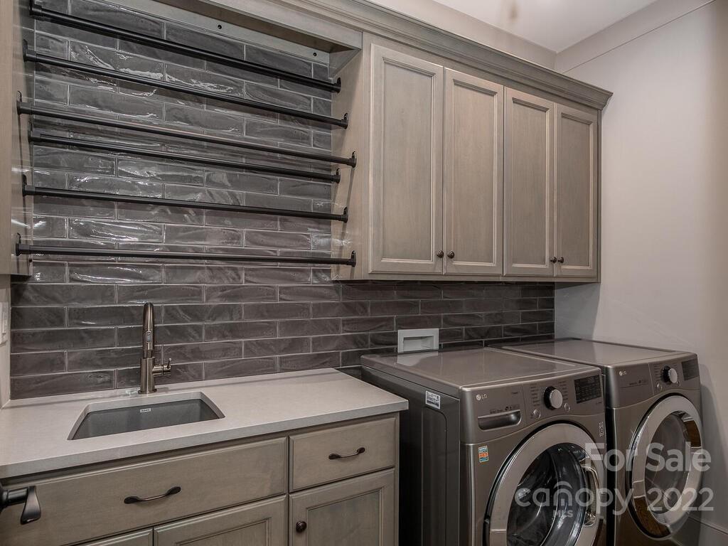 13601 Girl Scout Road Charlotte, NC 28278 - Photo 28 of 45 a utility room with dryer and washer