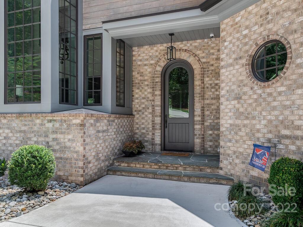 13601 Girl Scout Road Charlotte, NC 28278 - Photo 3 of 45 a front view of a house with a garden