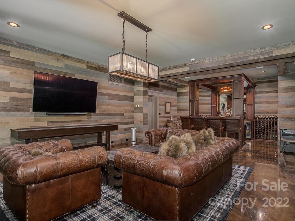 13601 Girl Scout Road Charlotte, NC 28278 - Photo 32 of 45 a living room with furniture and a flat screen tv