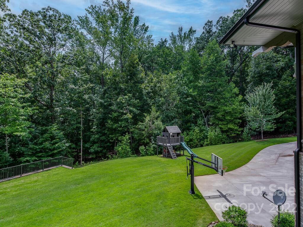 13601 Girl Scout Road Charlotte, NC 28278 - Photo 40 of 45 a view of a table and chairs in the garden