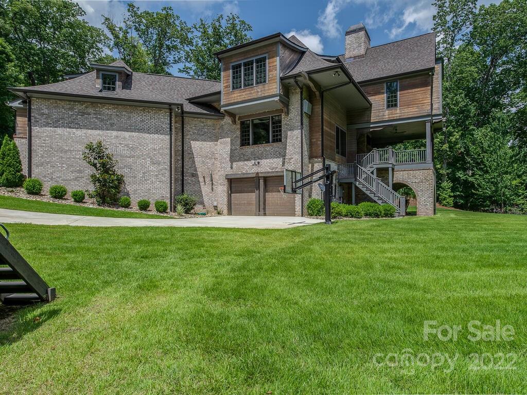 13601 Girl Scout Road Charlotte, NC 28278 - Photo 43 of 45 a view of a house with a big yard and large tree