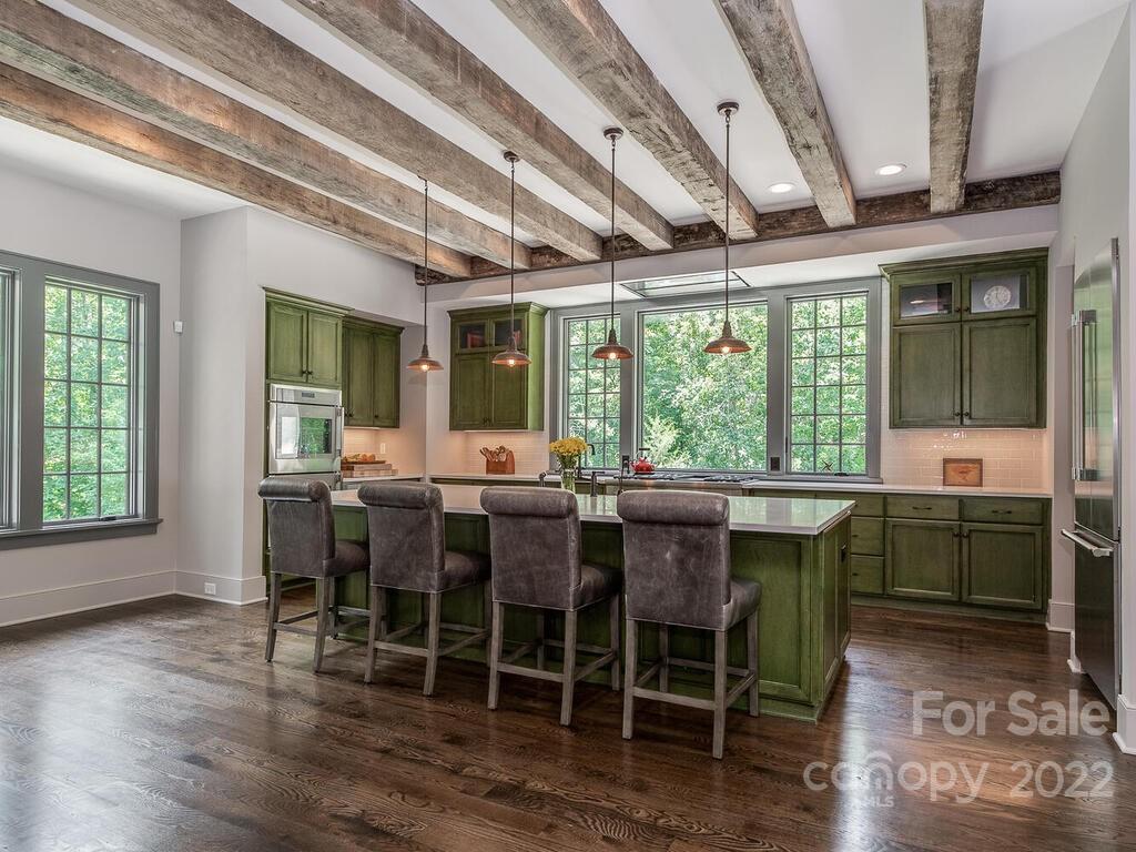 13601 Girl Scout Road Charlotte, NC 28278 - Photo 5 of 45 a view of a dining room with furniture window and wooden floor