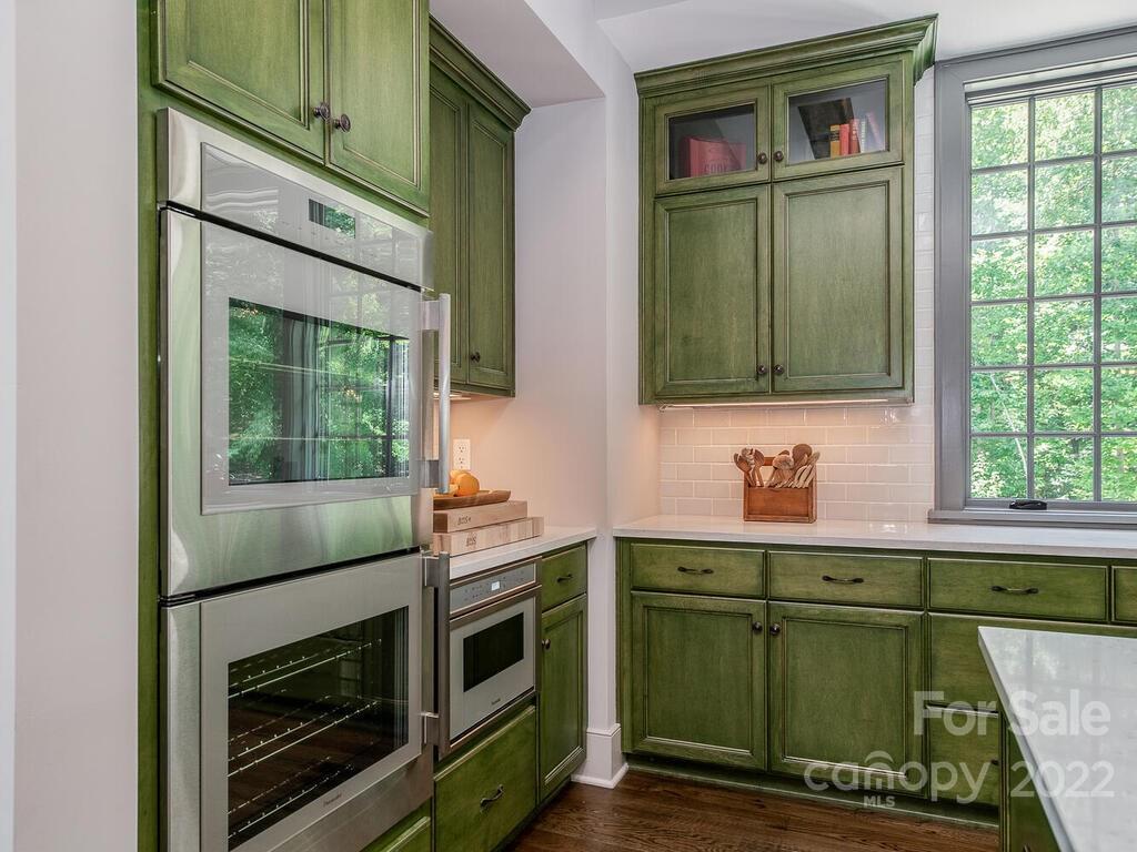 13601 Girl Scout Road Charlotte, NC 28278 - Photo 7 of 45 a kitchen with a sink and cabinets