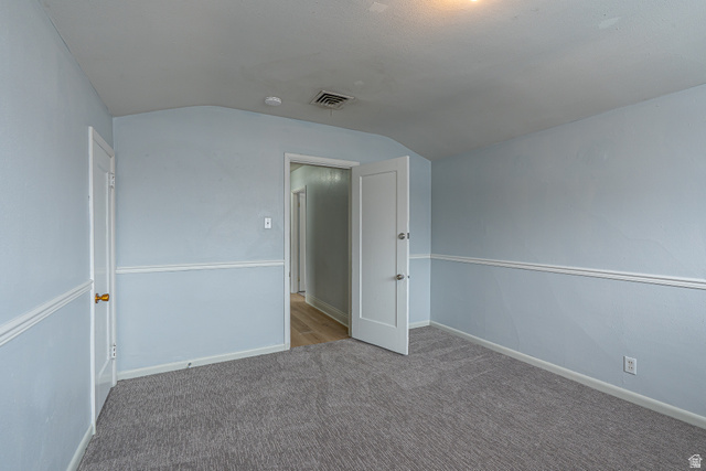33 North 200 East Logan, UT 84321 - Photo 32 of 54 Carpeted spare room with lofted ceiling and baseboards