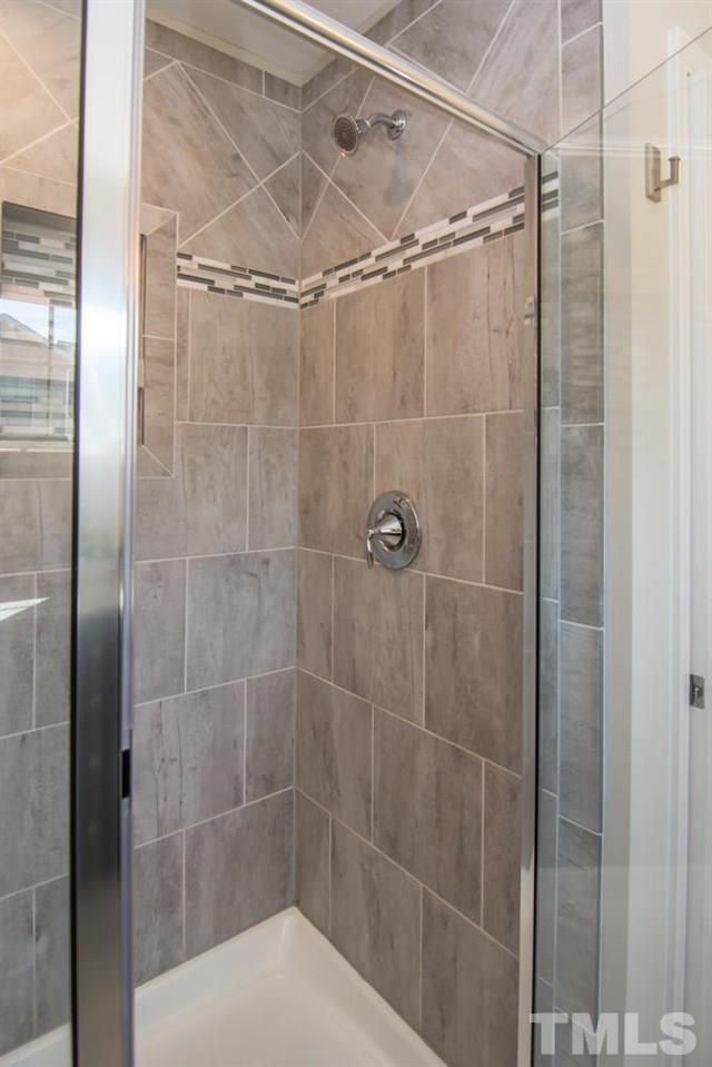 1240 Exchange Place Durham, NC 27713 - Photo 16 of 30 a bathroom with a shower and a toilet