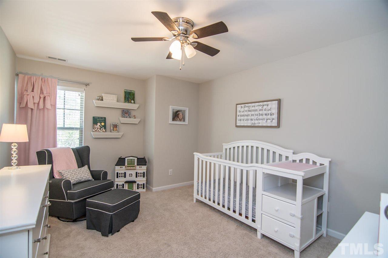 1240 Exchange Place Durham, NC 27713 - Photo 18 of 30 a bedroom with furniture and a window