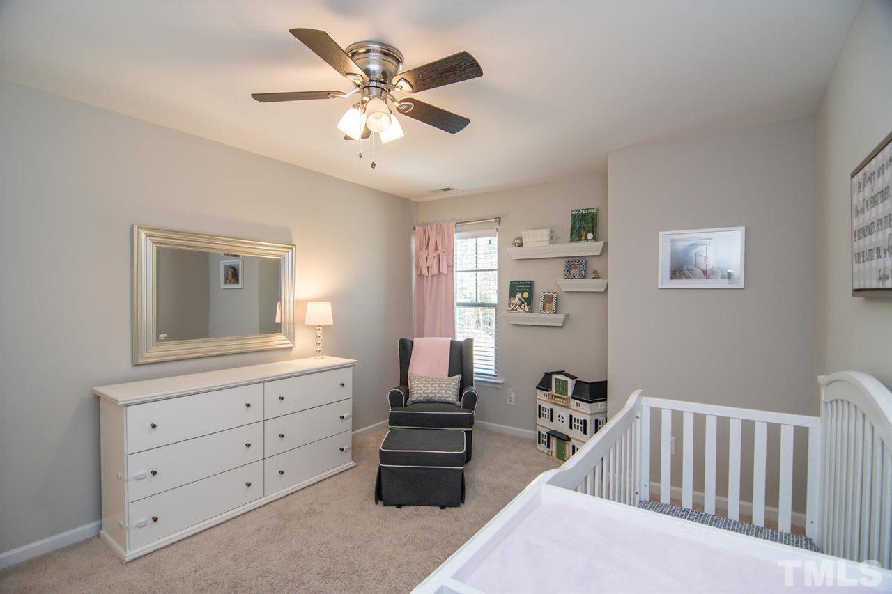 1240 Exchange Place Durham, NC 27713 - Photo 19 of 30 a bedroom with furniture and a window