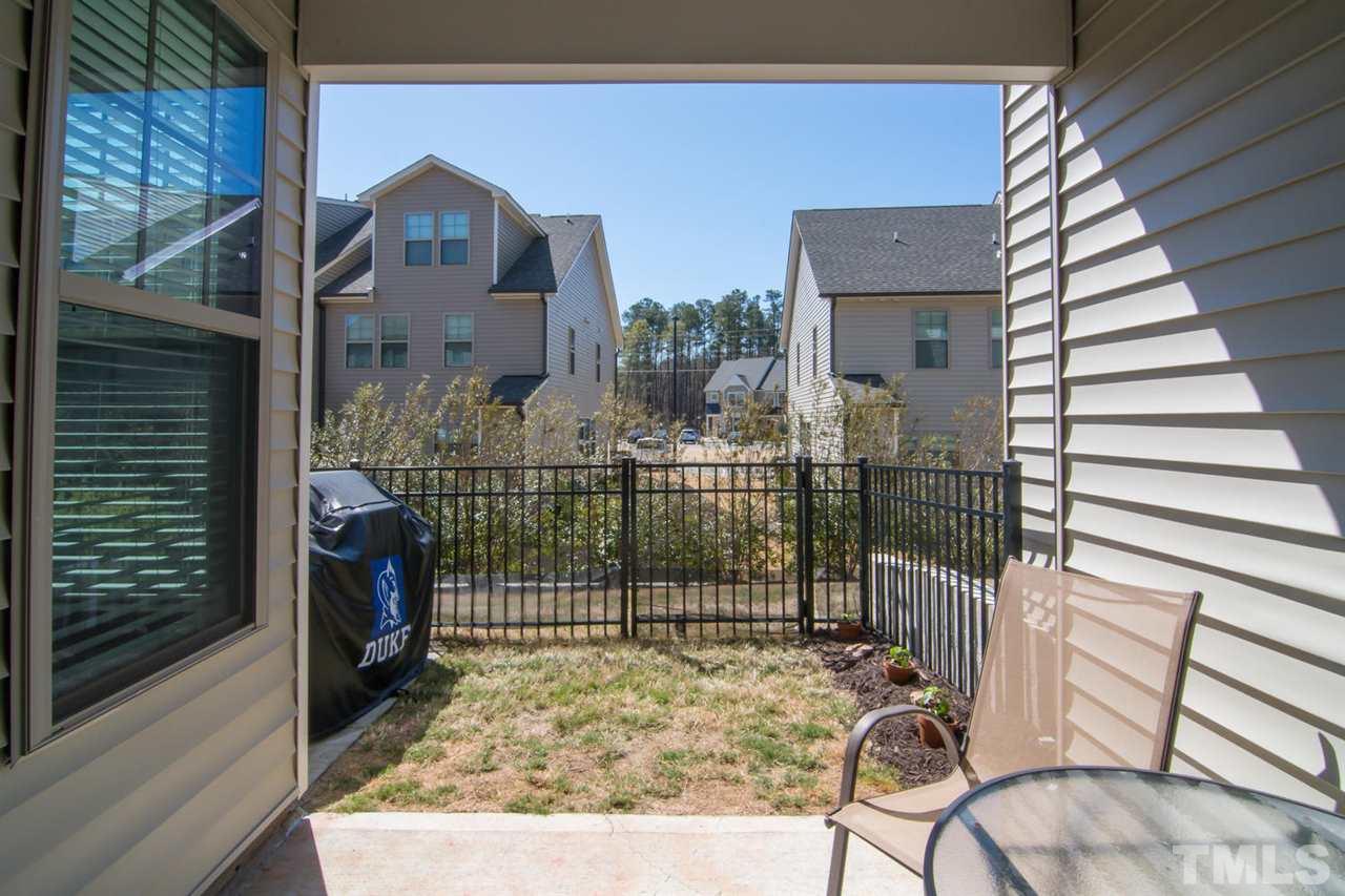 1240 Exchange Place Durham, NC 27713 - Photo 27 of 30 a view of a house with a wooden bench and chair