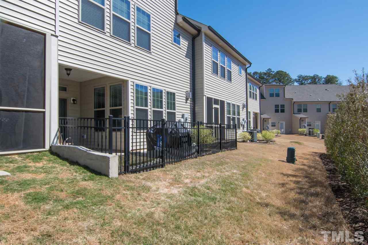 1240 Exchange Place Durham, NC 27713 - Photo 30 of 30 a view of backyard with a garden and deck
