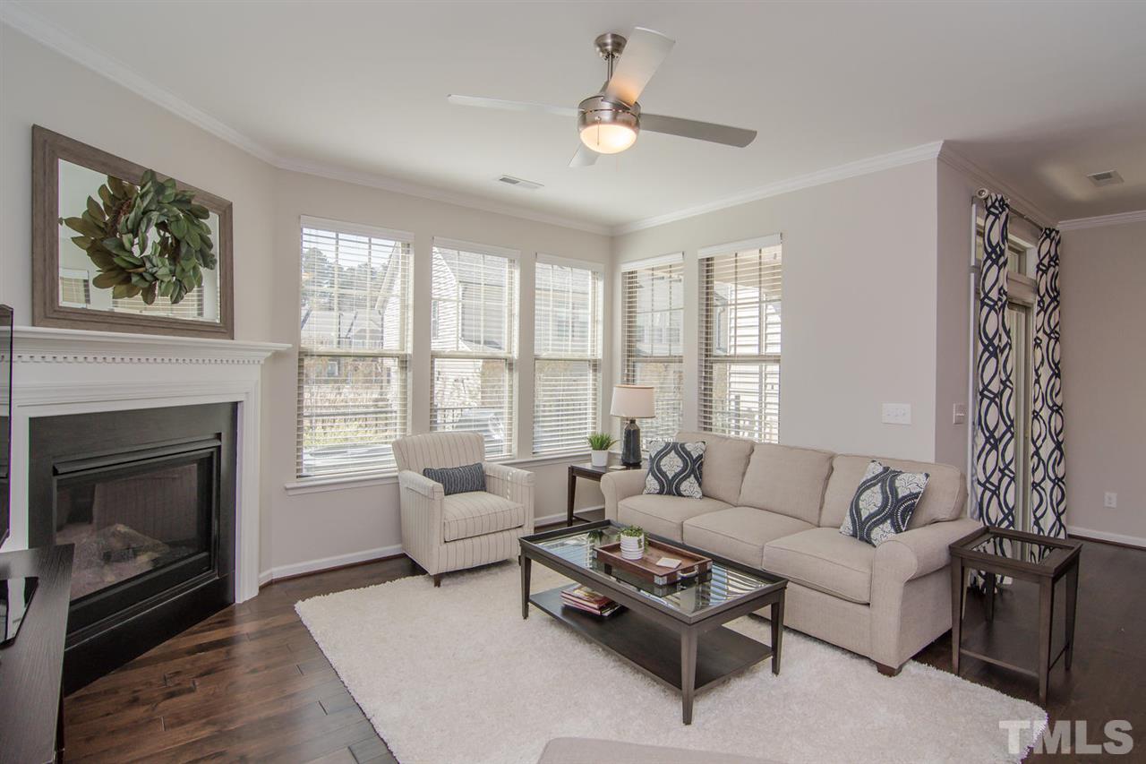 1240 Exchange Place Durham, NC 27713 - Photo 5 of 30 a living room with furniture a fireplace with a large window