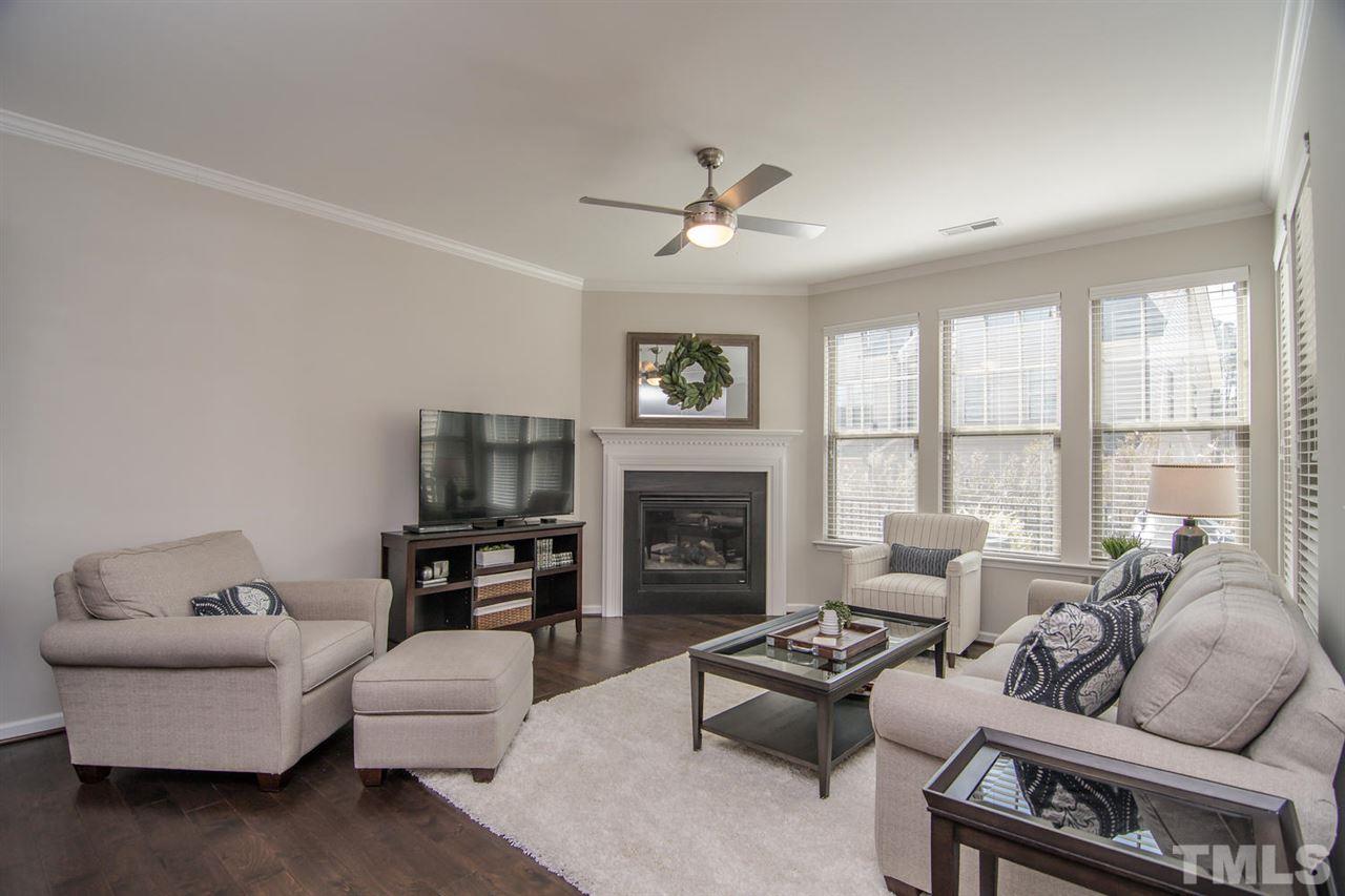 1240 Exchange Place Durham, NC 27713 - Photo 6 of 30 a living room with furniture fireplace and a large window