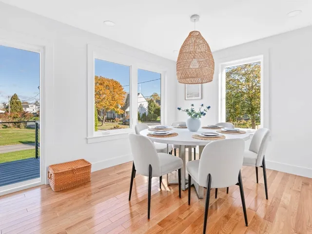 a dining room with furniture and a window