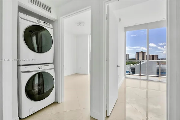 a kitchen with kitchen island granite countertop a stove a sink a oven a dining table and chairs
