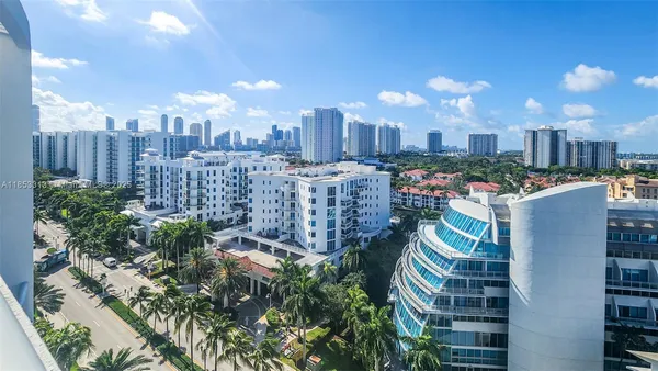 a view of a park with plants and bench