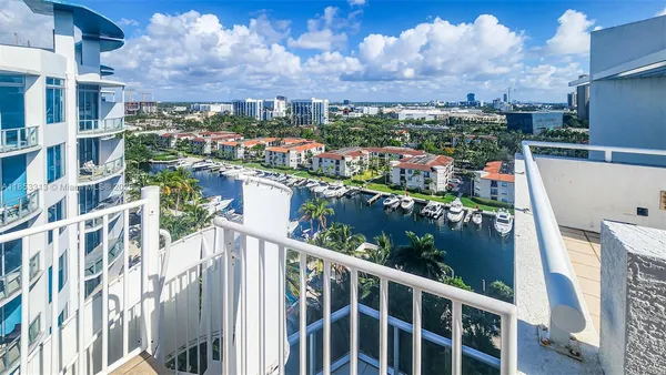 a very nice looking room with a large window and chandelier