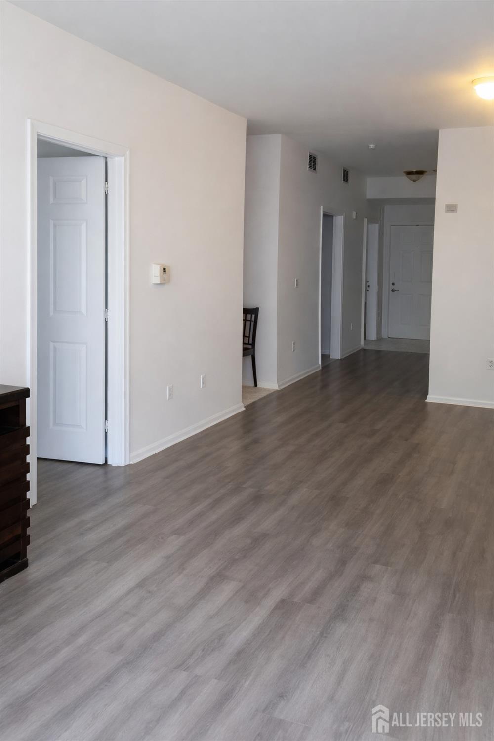 132 Remsen Avenue New Brunswick, NJ 08901 - Photo 5 of 11 a view of an empty room with wooden floor
