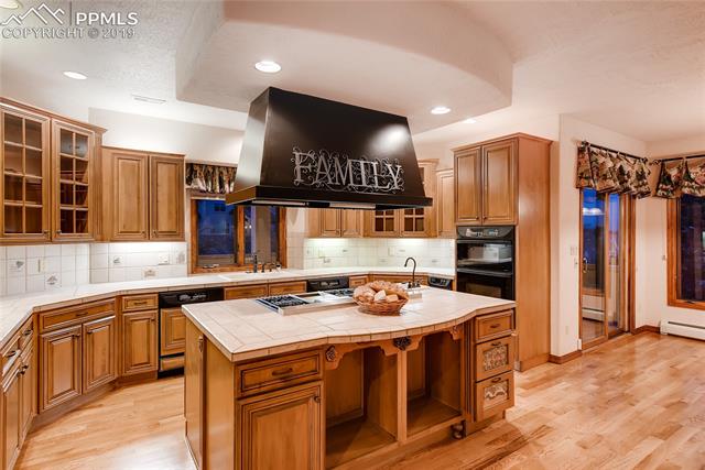 6155 Wilson Road Colorado Springs, CO 80919 - Photo 7 of 35 Gourmet kitchen, newly refinished hard wood floors throughout the main level