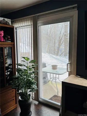 a room with furniture and a potted plant