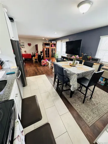 a bedroom with furniture and a chair