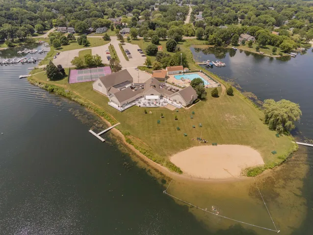 an aerial view of a house with a lake view