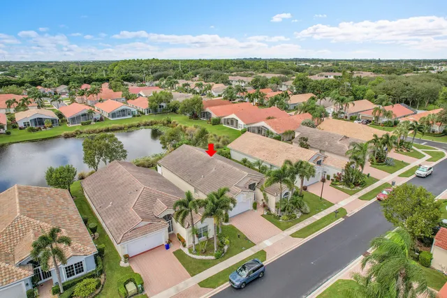 an aerial view of residential houses with outdoor space and river