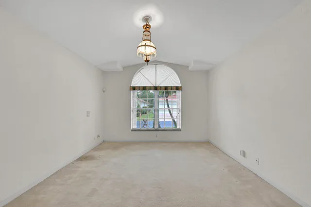 an empty room with a mirror