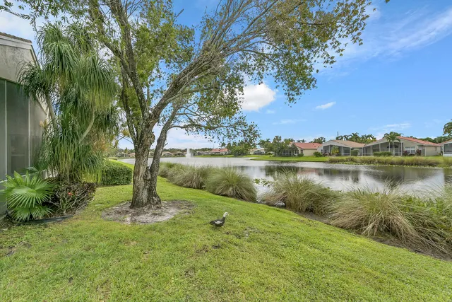 an aerial view of a house with a lake view
