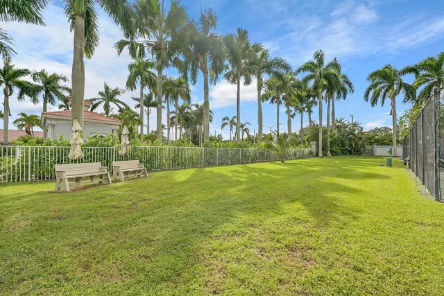 an aerial view of residential houses with outdoor space and street view