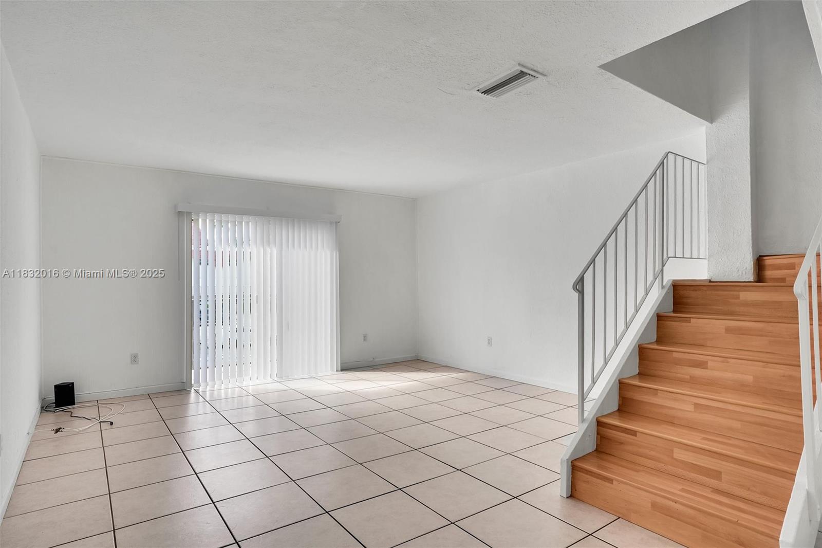 8650 Southwest 67th Avenue, Unit 1025 Pinecrest, FL 33156 - Photo 11 of 26 a view of an entryway with wooden floor
