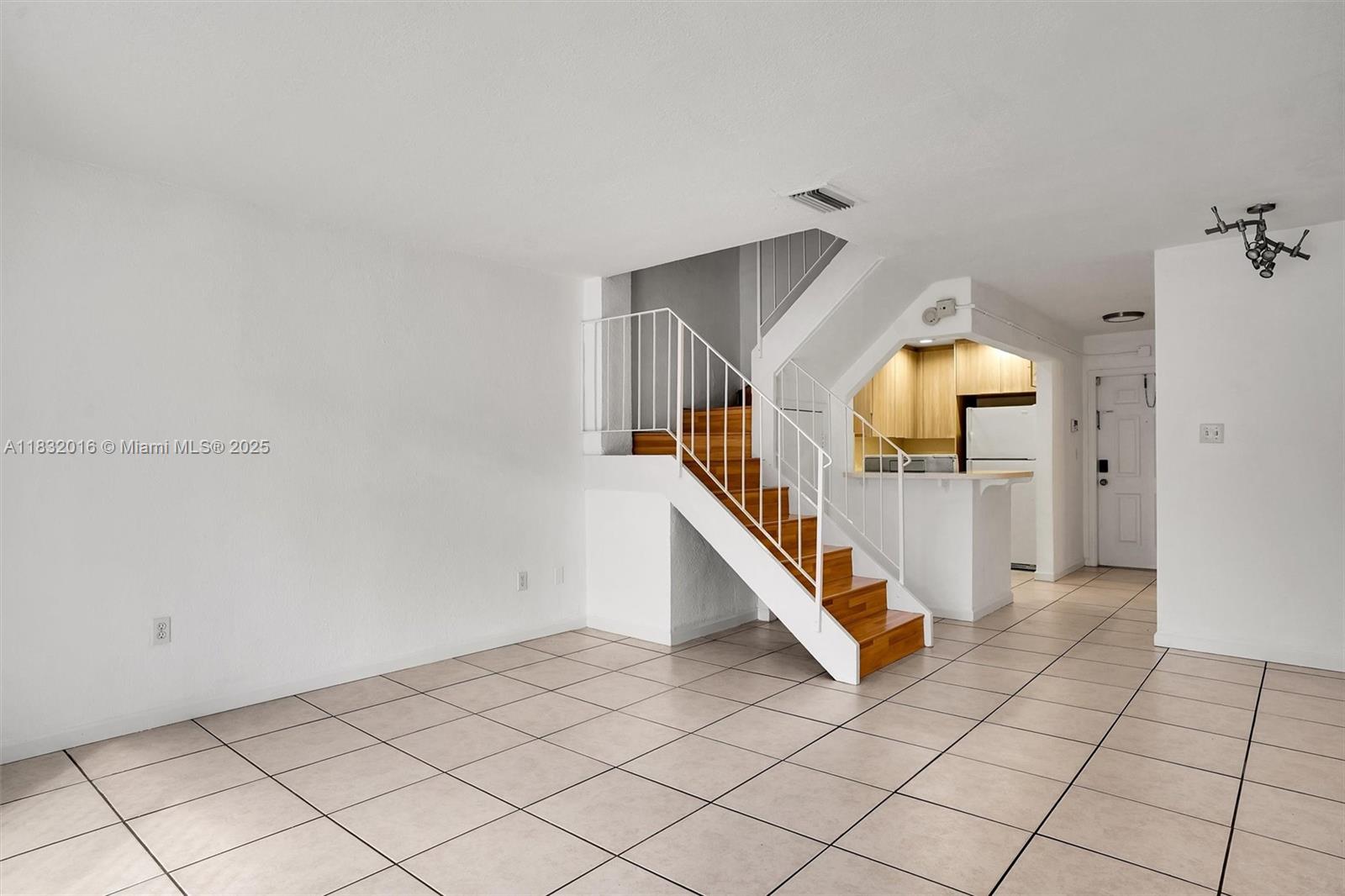 8650 Southwest 67th Avenue, Unit 1025 Pinecrest, FL 33156 - Photo 12 of 26 a view of an entryway with wooden floor