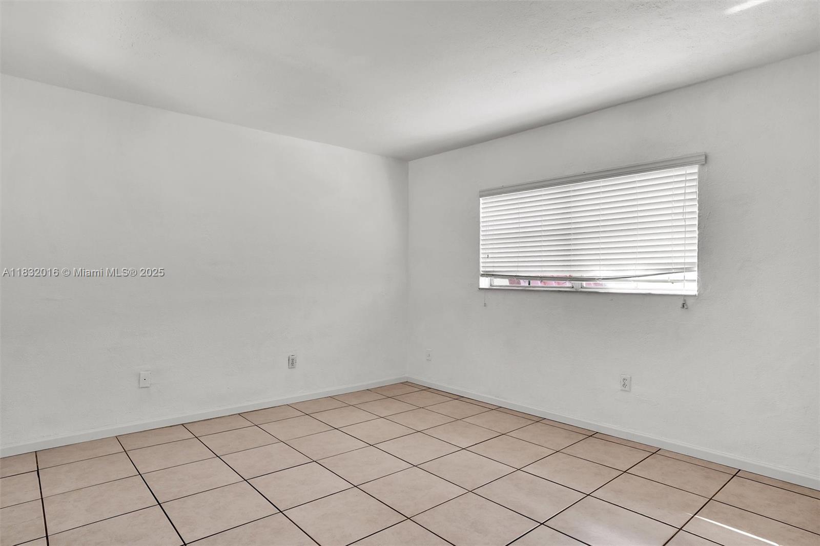 8650 Southwest 67th Avenue, Unit 1025 Pinecrest, FL 33156 - Photo 20 of 26 a view of a room that has a window