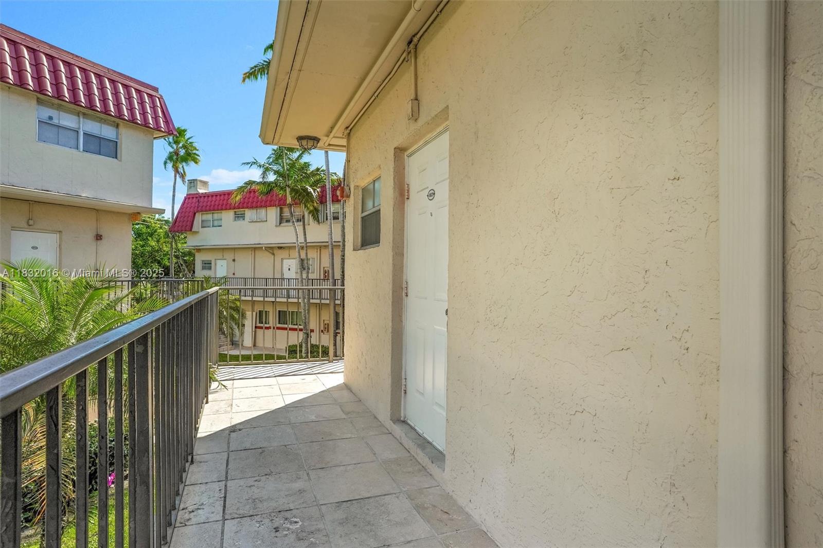 8650 Southwest 67th Avenue, Unit 1025 Pinecrest, FL 33156 - Photo 2 of 26 a view of balcony with wooden floor