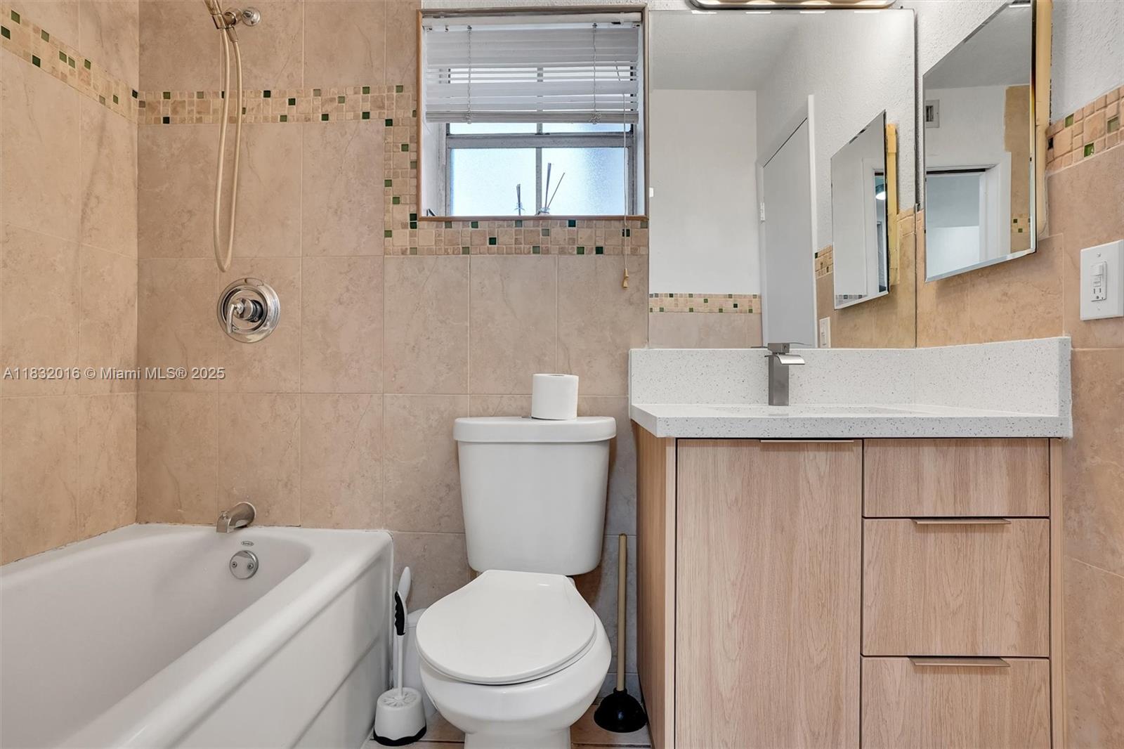 8650 Southwest 67th Avenue, Unit 1025 Pinecrest, FL 33156 - Photo 26 of 26 a bathroom with a sink a toilet and shower