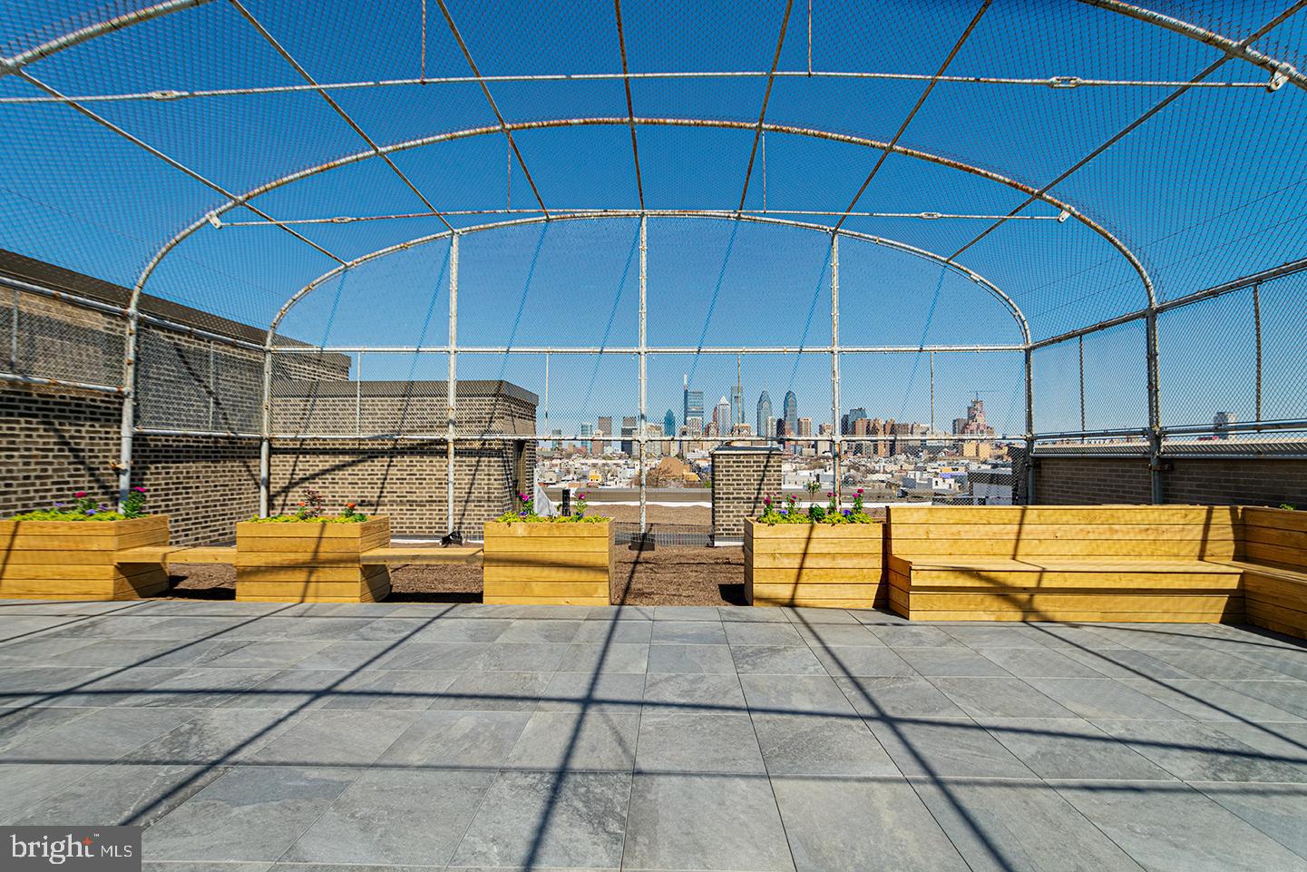 1300 South 19th Street, Unit 316 Philadelphia, PA 19146 - Photo 14 of 19 a view of a swimming pool with a lounge chair