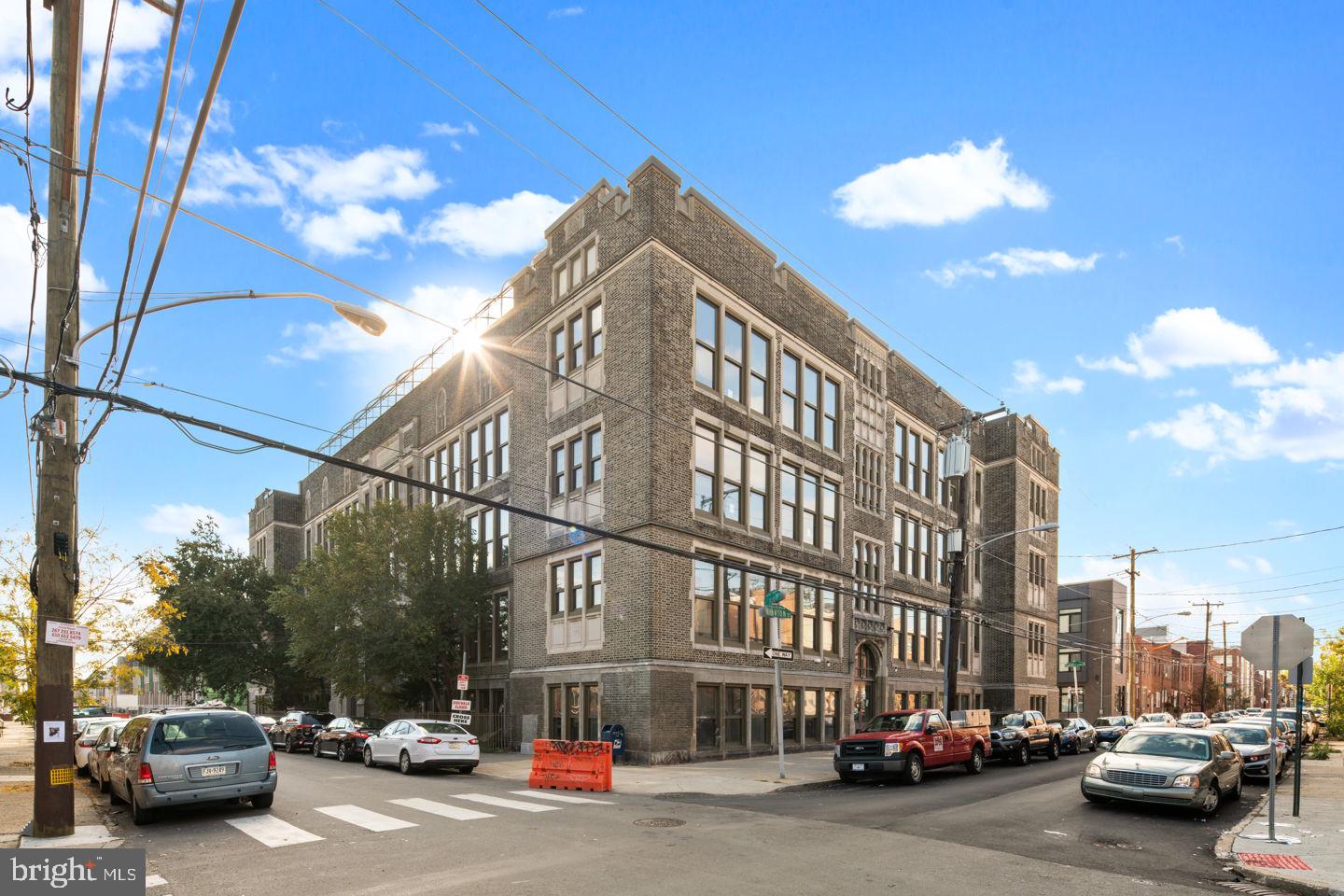 1300 South 19th Street, Unit 316 Philadelphia, PA 19146 - Photo 19 of 19 a city street lined with parked cars and buildings