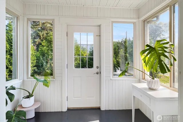 a view of entryway with wooden floor and a potted plant