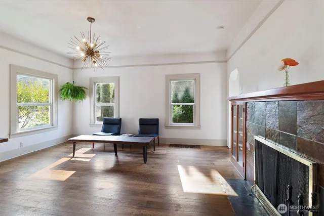 a workspace with wooden floor and a window