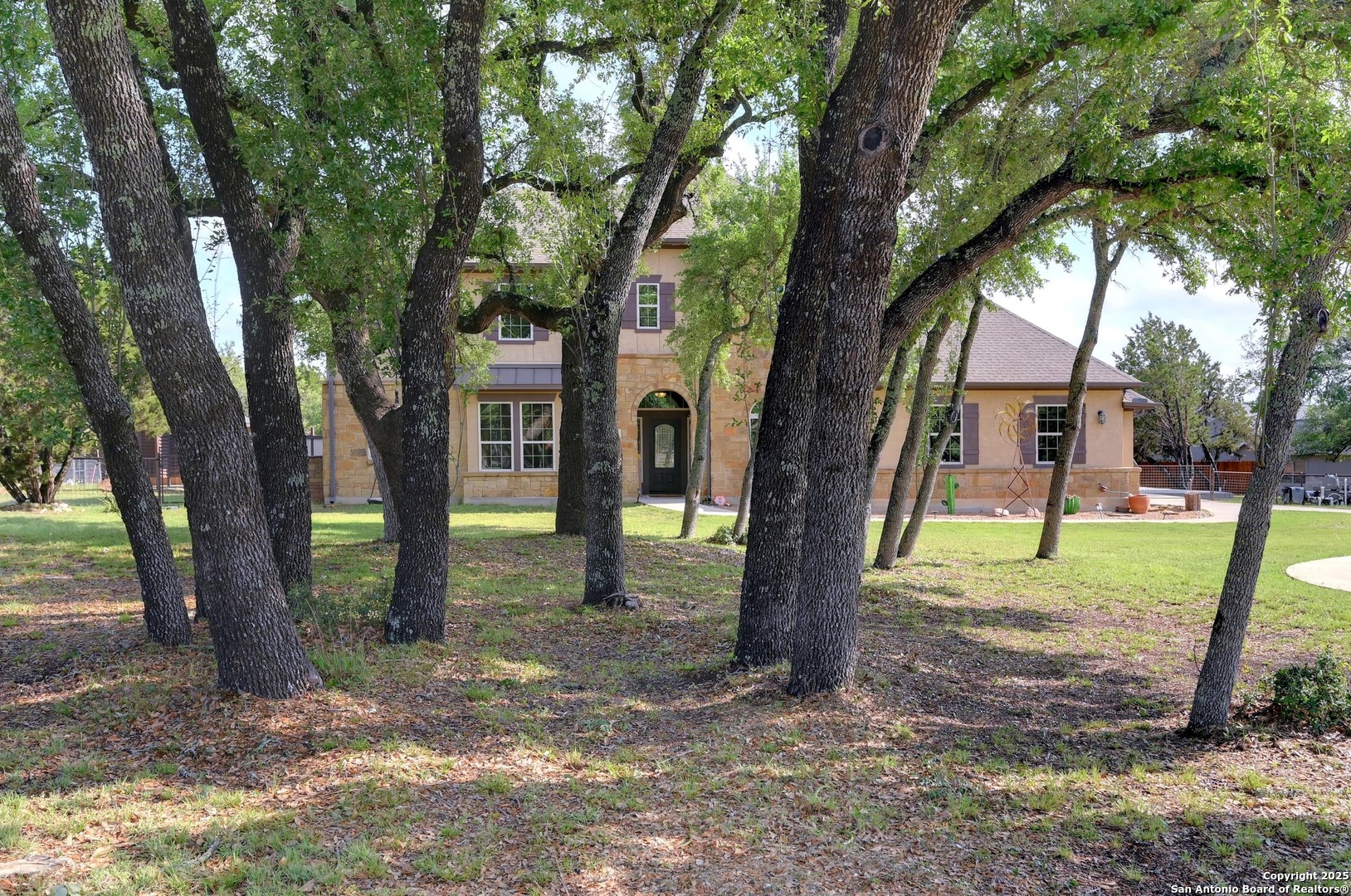 101 La Rosa Drive Blanco, TX 78606 - Photo 30 of 31 a view of a trees in the front of a house