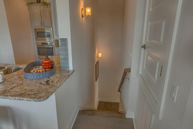 11 Pine Lands Loop Inlet Beach East, Unit C Inlet Beach, FL 32461 - Photo 22 of 30 a bathroom with a granite countertop sink and a shower